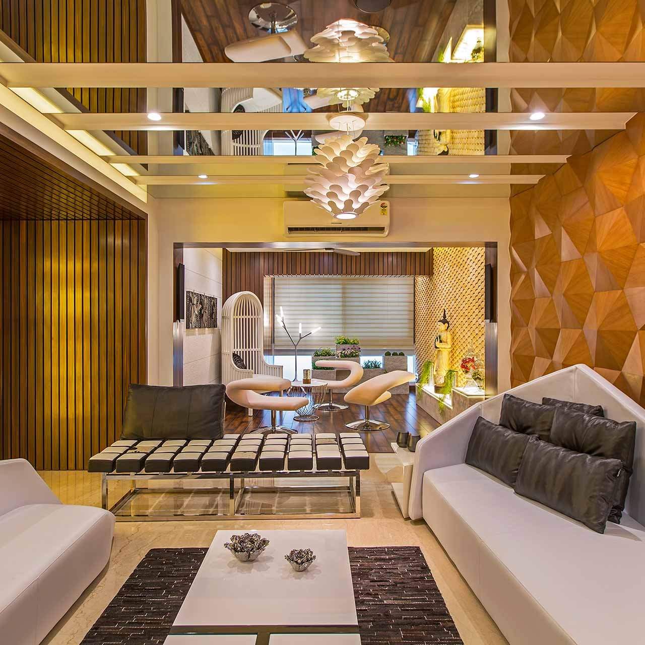 Double-height villa living room interior by BYTS Interior