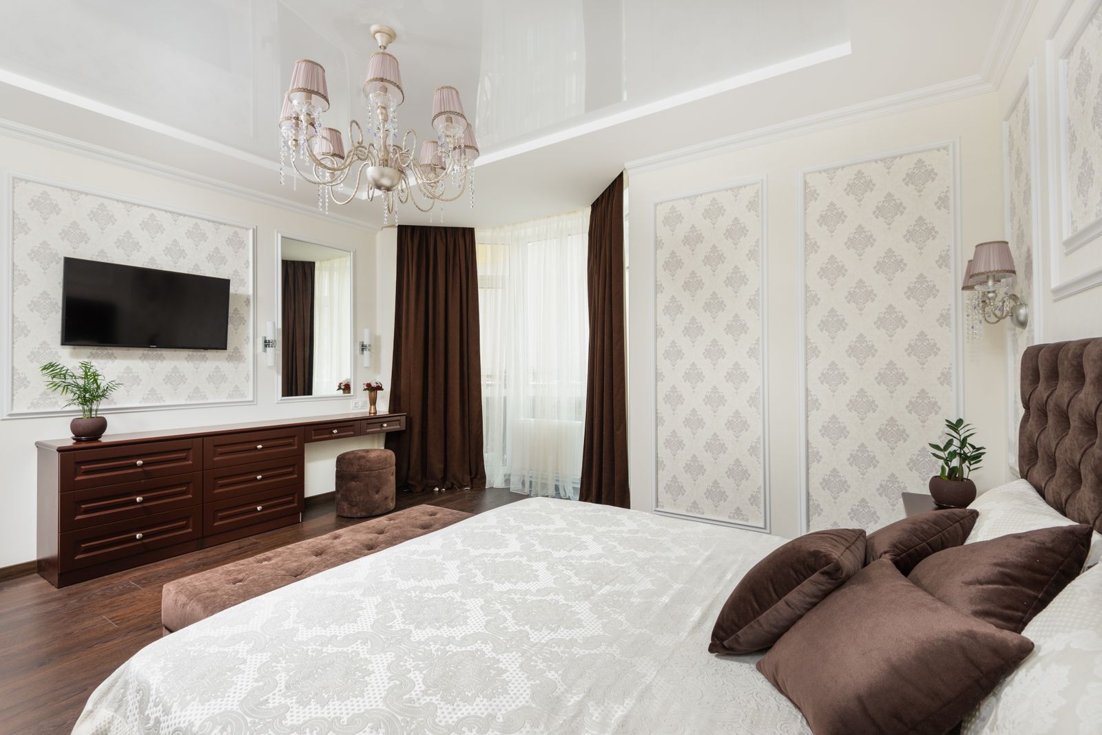 Bedroom interior with bed, side units and soft lighting